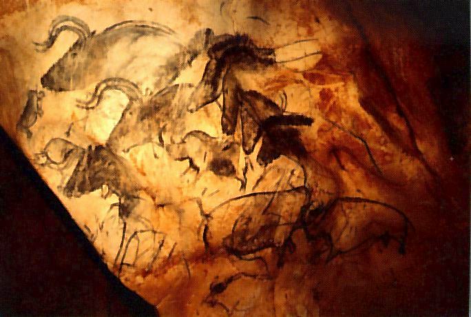 Image Description: Cave Painting featuring several animals including equines and bovines.